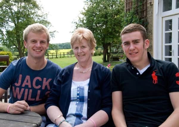 Judith Satchwills and her sons