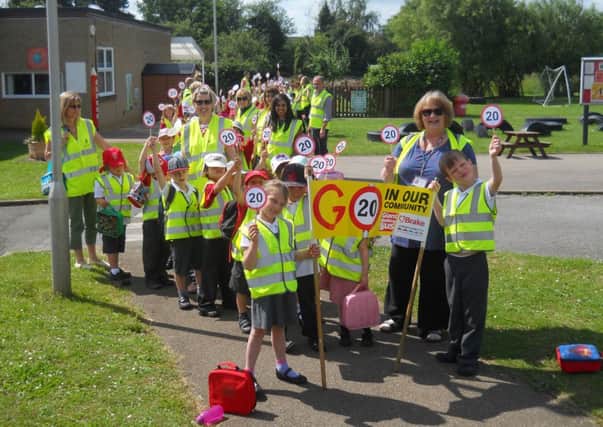 Children from Caldecote Lower School take part in the Giant Walking Bus to promote road safety. PNL-141107-103245001