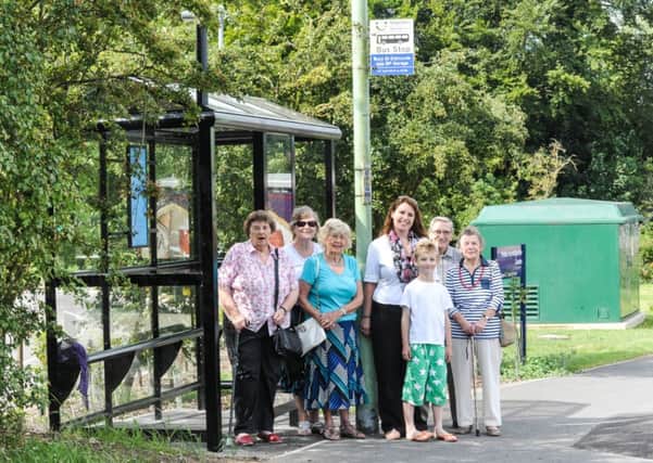 Suffolk county councillor Sarah Stamp with residents at the new bus shelter