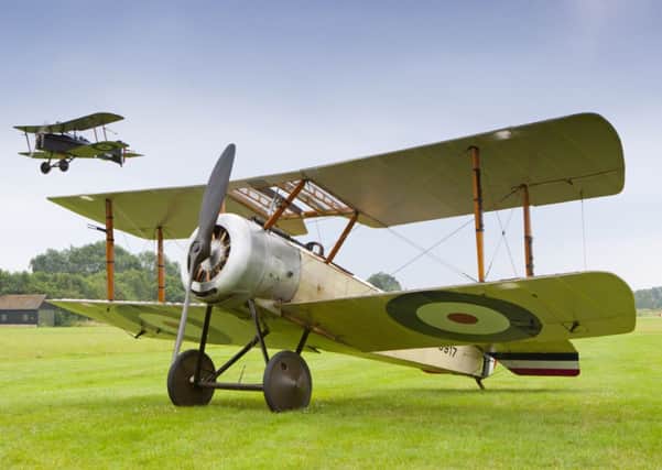SE5a (in the air) and the Sopwith Pup on the ground at Shuttleworth PNL-140508-110048001