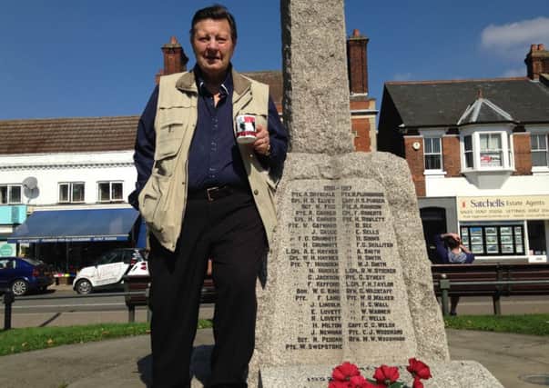 George Wilson with a First World War commemorative mug. PNL-141109-131359001
