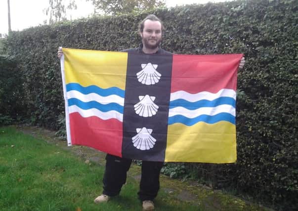 Luke Blackstaffe with his Bedfordshire flag