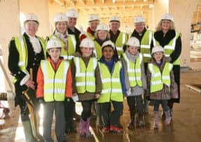 Pupils and dignitaries at the topping out ceremony at St Andrew's Lower School's new campus on Kings Reach, Biggleswade. PNL-151201-160819001