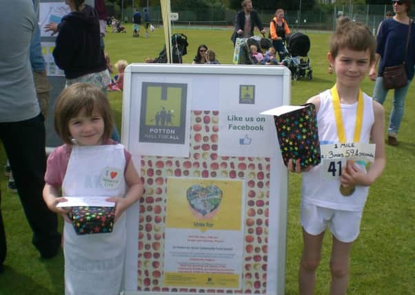 Cordelia and Kieran Evetts winning the fancy dress competition run by Potton Hall for All at the May Day Fete this year