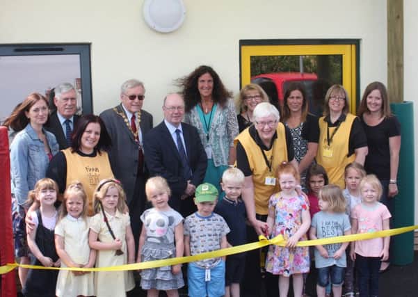 Little learners cut the ribbon to celebrate the opening of Pippin Pre-School's new building