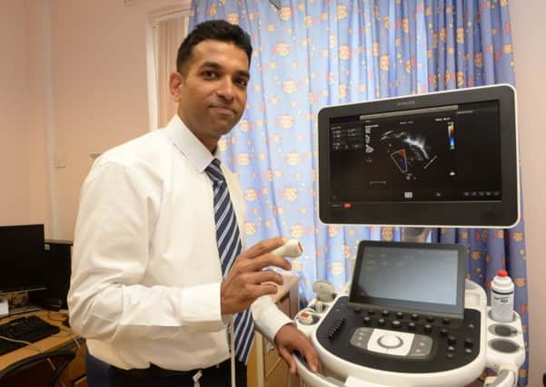 Bedford Hospital's Dr Nair with the new ultrasound multiscanner PNL-150508-094613001