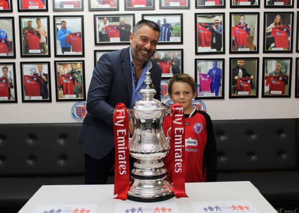 Biggleswade United Director of Football Guillem Balague and a young fan with the FA Cup