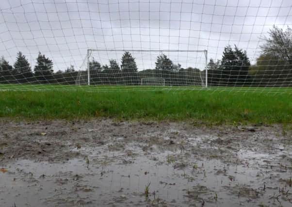 Waterlogged pitch.