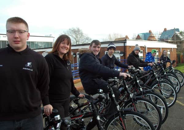 George from Pedals, PE teacher Wendy Chantrell and Ivel Valley School pupils with their new fleet of bicycles