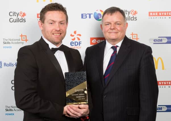 Lee Mason Liebherr GB Ltd  receives award from Steve Hull of BAESystems. Picture by Michael Crabtree