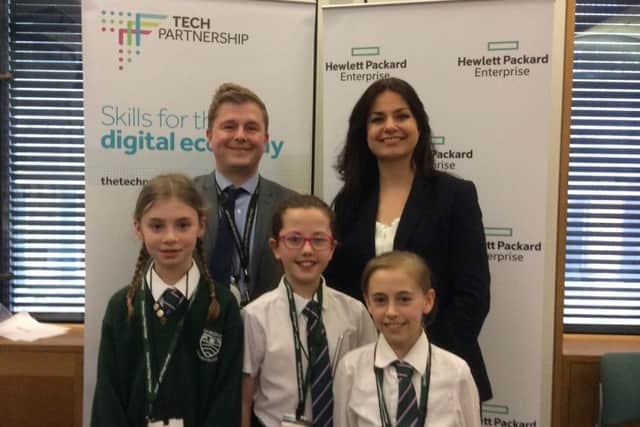 Gamlingay Village College Headteacher James Birkett and Heidi Allen, MP for South Cambridgeshire, with students at Parliament.