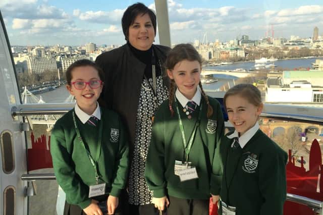 Emma Sunderland and Gamlingay Village College students at the London Eye. Picture: Matt Chung