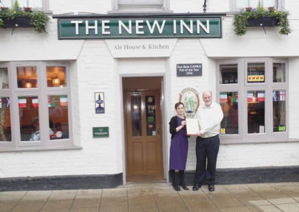 Corri and Rodney Burke at the New Inn with their award from Camra.