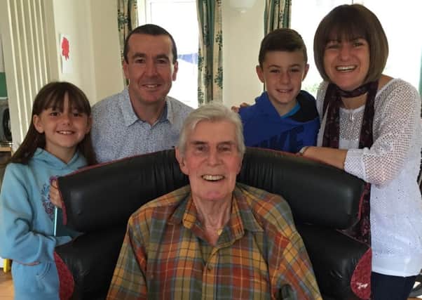 David Moss, with his father Brian, and from left, daughter Abby, son Jacob and wife Jayne.