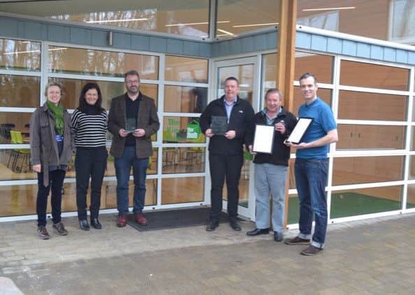 Gamlingay Eco Hub wins awards from RIBA - celebrating are, from left, Leanne Bacon, parish clerk,  Bridget Smith, project manager, Andrew Biddall, Civic Partners - architects,  Rob Hutchinson, S and G Hutchinson - contractor,  Martin West, S and G Hutchinson, Dan Jones, Civic Partnership - architects.