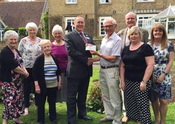 Befrienders donation to St John's Hospice - Picture Left to right (back row) Ruth Presley, Pat Parkinson, Rita Beaumont, Mike Coward  St Johns, 
Gordon Beeden, Colin Albon (front row) Rosemary Albon, Pauline Panter and Tracy Haddock  St Johns