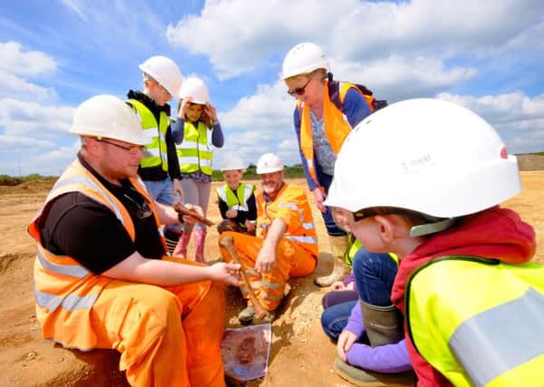 Roxton Lower School pupils discover archaeology at Black Cat Quarry -  far left, Ben Dyson of Archaeological Research Services; centre, Hopes Quarry Manager Simon Bryant; standing right, Roxton Lower School head teacher Jane Trott.