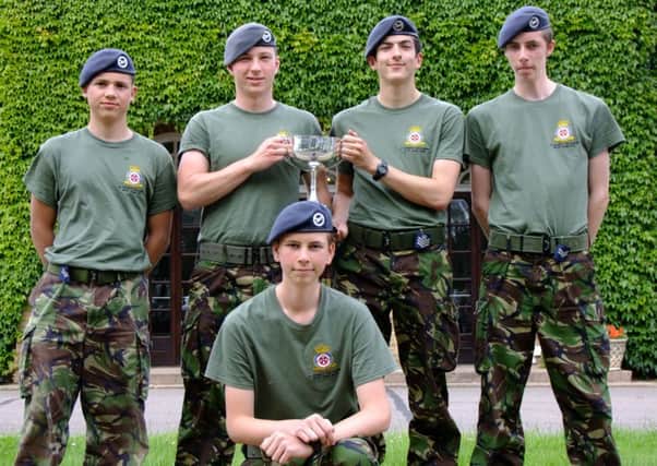 Sandy Air Cadets Banner Drill Team with the trophy, from left, Cpl George Arnold, FS Ian Mansion, Cdt Elliot Croucher, FS Peter Hessey, Cpl Foster