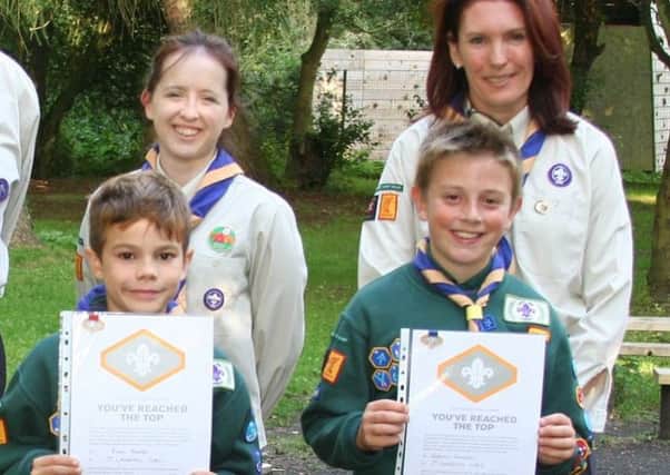 1st Langford Cubs receive Chief Scout silver awards - Ryan, left, and Jeremy, with leaders Becca Harris and Jo Smith.