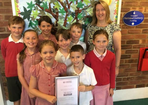 Headteacher Juliet Parker and children at Shillington Lower School with their award.