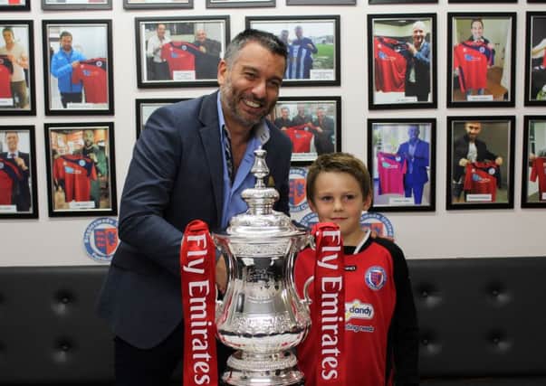 Biggleswade United Director of Football Guillem Balague and a young fan with the FA Cup PNL-150508-110928001