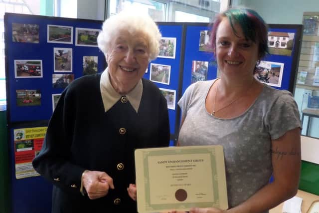 Hayley Stewart of College Road receiving a Silver Gilt Award from Peggy Kettleborough for Best Small or Courtyard Garden.
