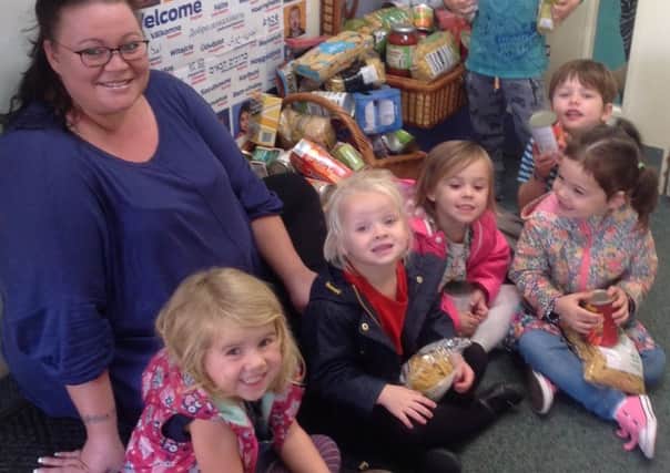 The Lawns Nursery collect food for needy families