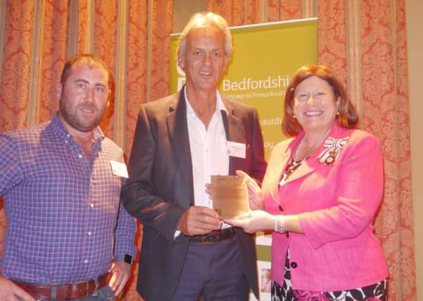 CPRE Mark awarded to Jordans Mill, from left, Tom Baker, Site General Manager, Bill Jordan, and Lord Lieutenant of Bedfordshire Helen Nellis.