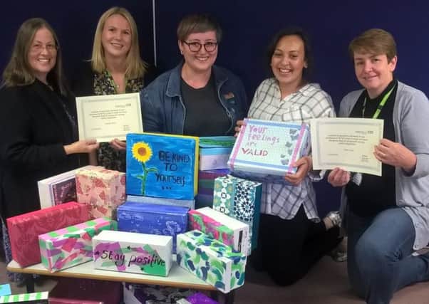 Teenagers who completed their NCS with the sensory boxes they made to support youngsters with mental health issues