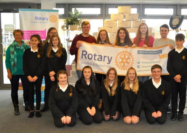 Pupils at Samuel Whitbread Academy with Beverley Blackham of the Rotary Club and Tony Edwards.