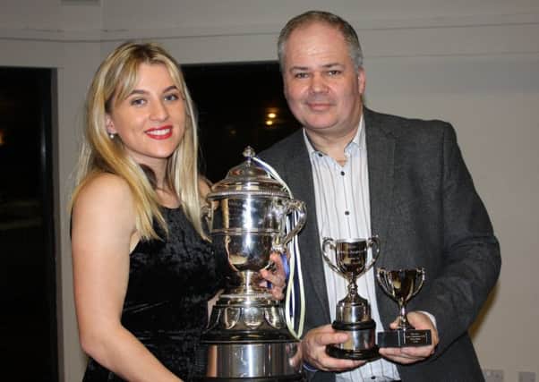 Annabel Pitts receiving trophies from Beadlow Manor General Manager, James Hetherington. PNL-170102-171219002