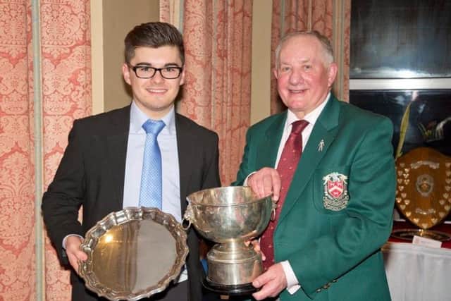 Jack Slater winner of John O'Gaunt Club Championship, Club Boys Championship and Division 1 Handicap Trophy with Richard Aubigne, Club Captain. PNL-170103-144959002