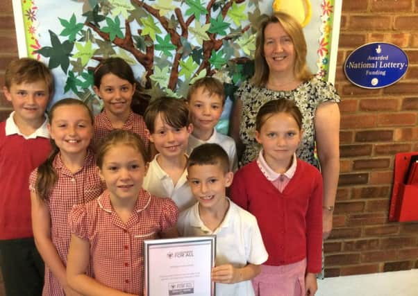 Headteacher Juliet Parker and children at Shillington Lower School with their award. PNL-160727-112303001