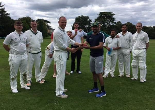 Hammad Nasir is presented with the match ball after taking 5 wickets for Southill Park. PNL-170816-115336002